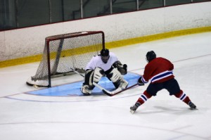 Hockey goalie makes save